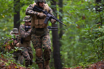 Image showing Modern warfare Soldiers  Squad  in battle