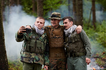 Image showing soldiers and terrorist taking selfie