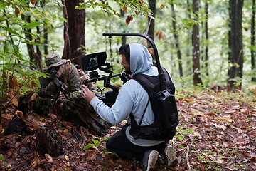 Image showing Videographer Taking Action Shoot of Soldiers in Action