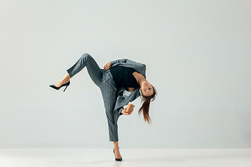 Image showing Happy business woman dancing and smiling isolated over white.