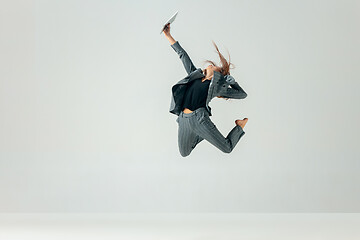 Image showing Happy business woman dancing and smiling isolated over white.