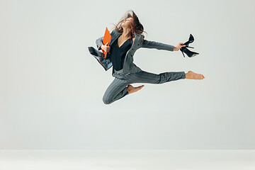 Image showing Happy business woman dancing and smiling isolated over white.