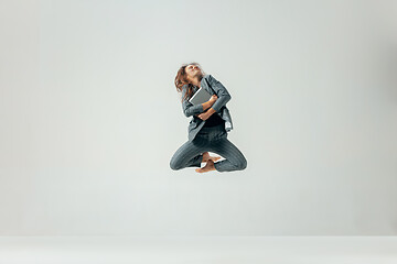 Image showing Happy business woman dancing and smiling isolated over white.