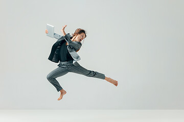 Image showing Happy business woman dancing and smiling isolated over white.