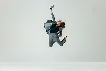 Image showing Happy business woman dancing and smiling isolated over white.