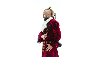 Image showing The young man wearing a traditional medieval costume of marquis