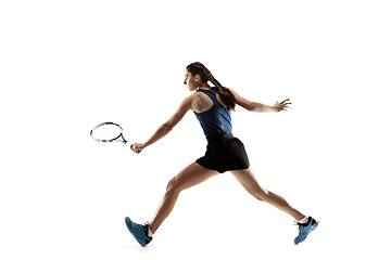 Image showing Full length portrait of young woman playing tennis isolated on white background