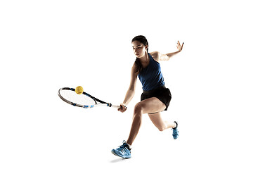 Image showing Full length portrait of young woman playing tennis isolated on white background