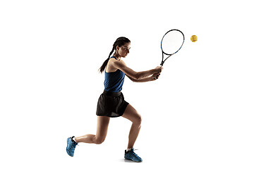 Image showing Full length portrait of young woman playing tennis isolated on white background