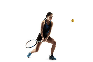 Image showing Full length portrait of young woman playing tennis isolated on white background