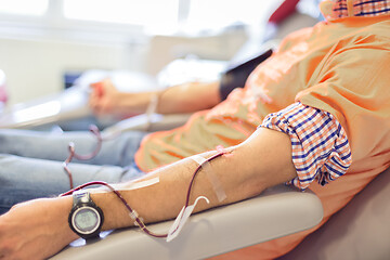 Image showing Blood donor at donation with a bouncy ball holding in hand