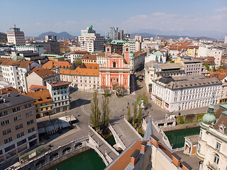 Image showing Aerial drone view of Preseren Squere and Triple Bridge over Ljubljanica river,Tromostovje, Ljubljana, Slovenia. Empty streets during corona virus pandemic social distancing measures