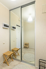 Image showing Large fitted wardrobe with large mirrors on the doors