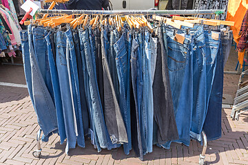 Image showing Hanging Jeans Pants