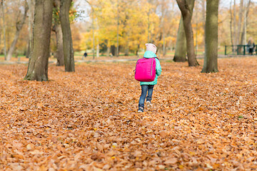 Image showing little girl with school bag at autumn park