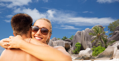 Image showing happy couple hugging on summer beach