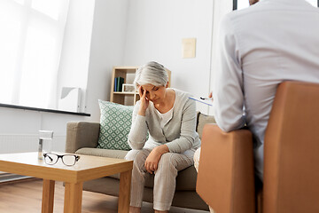 Image showing sad senior woman patient and psychologist