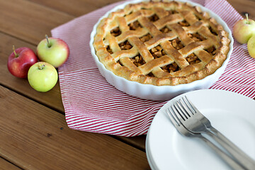 Image showing apple pie in baking mold on wooden table