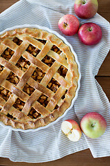 Image showing apple pie in baking mold on wooden table