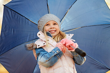 Image showing happy little girl with umbrella at autumn park