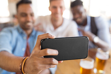 Image showing friends taking selfie and drinking beer at bar