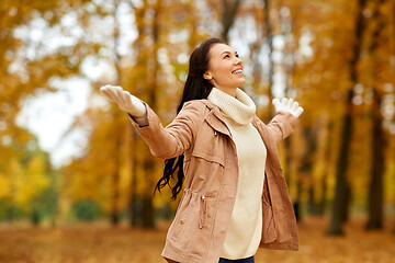 Image showing beautiful happy young woman in autumn park