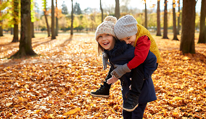 Image showing happy children having fun at autumn park