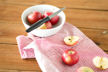 Image showing apples and kitchen knife on towel