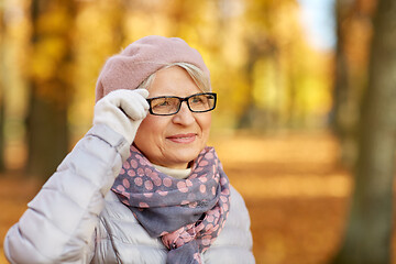 Image showing portrait of happy senior woman at autumn park