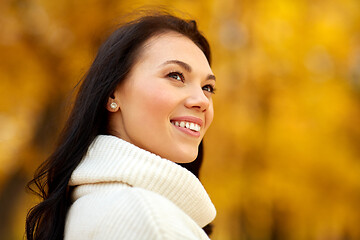 Image showing portrait of happy young woman in autumn park