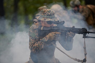 Image showing Modern warfare Soldiers  Squad  in battle