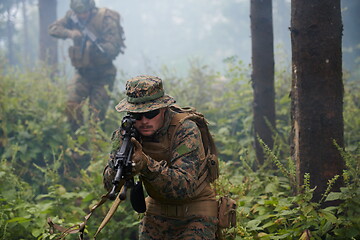 Image showing Modern warfare Soldiers  Squad  in battle