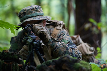 Image showing soldier in action aiming  on weapon  laser sight optics