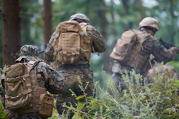 Image showing Modern warfare Soldiers  Squad  in battle