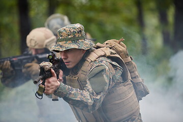 Image showing Modern warfare Soldiers  Squad  in battle