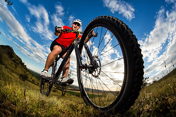 Image showing Mountain Bike cyclist riding single track outdoor