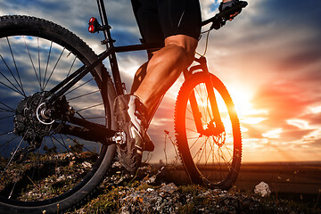 Image showing cyclist man legs riding mountain bike on outdoor trail