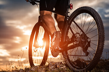 Image showing cyclist man legs riding mountain bike on outdoor trail