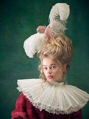 Image showing Young woman as Marie Antoinette on dark background. Retro style, comparison of eras concept.