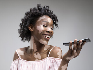 Image showing Studio portrait of african-american woman with vitiligo skin, beauty concept