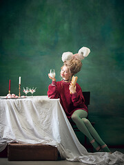 Image showing Young woman as Marie Antoinette on dark background. Retro style, comparison of eras concept.