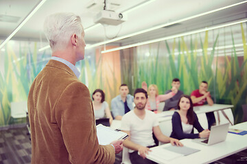 Image showing teacher with a group of students in classroom