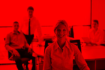 Image showing business woman with her staff in background at office