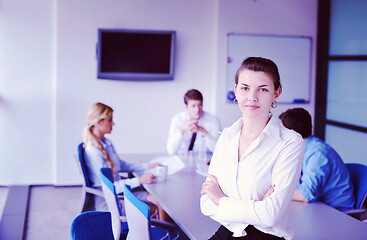 Image showing business woman with her staff in background at office