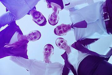 Image showing business people with their heads together