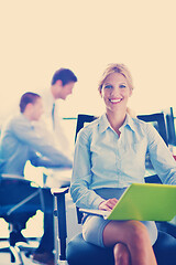 Image showing business woman with her staff in background at office