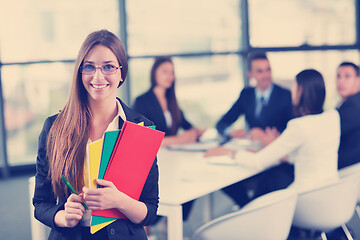 Image showing business woman with her staff in background at office