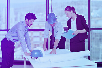 Image showing business people and construction engineers on meeting