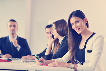 Image showing business woman with her staff in background at office