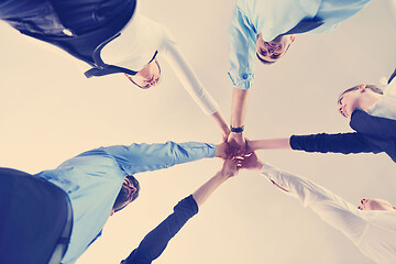 Image showing business people group joining hands